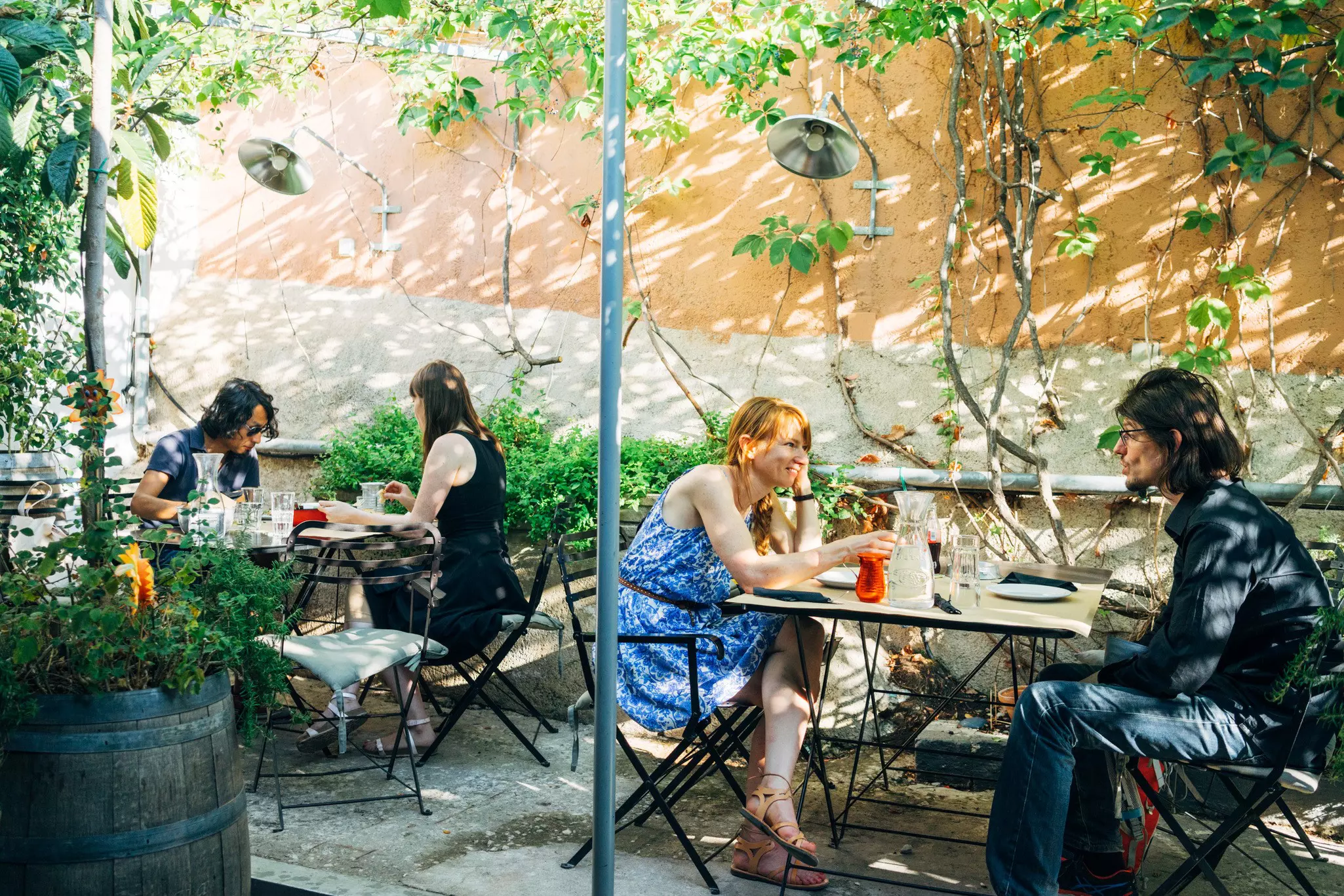 People sitting in a cafe in Exarchia, Athens, Greece