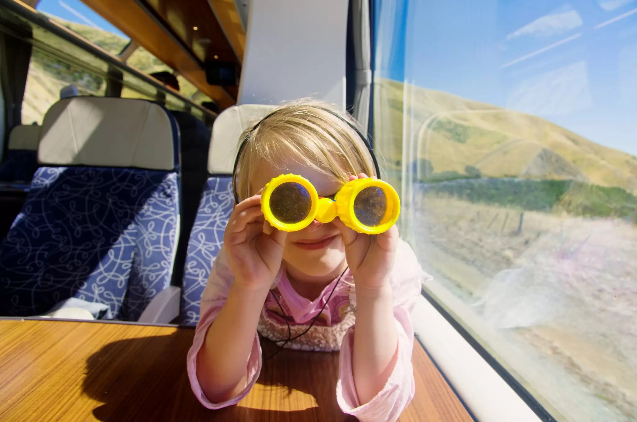 Train travel can be an conscious way to satisfy your wanderlust. Bonita Cooke / Getty Images