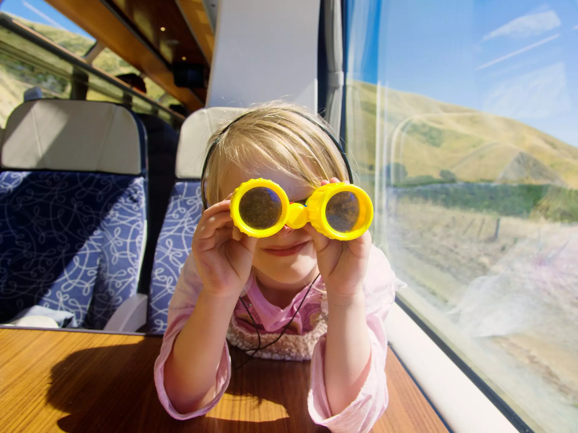 Train travel can be an conscious way to satisfy your wanderlust. Bonita Cooke / Getty Images