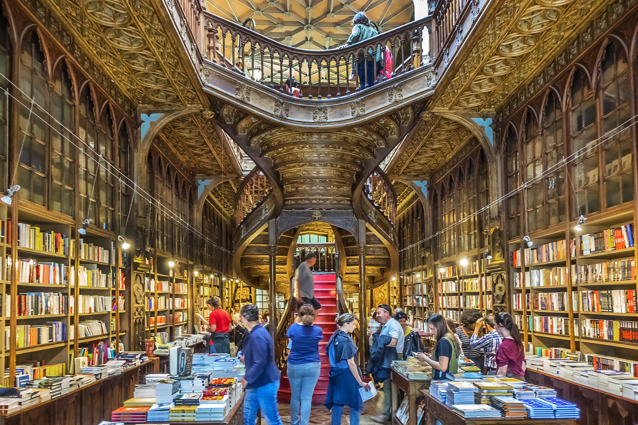 APRIL 19, 2017: Customers browse books inside the famous bookshop, Lello e Irmao (1906).