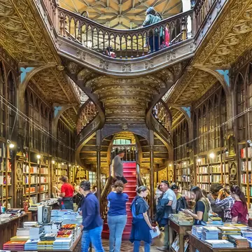 APRIL 19, 2017: Customers browse books inside the famous bookshop, Lello e Irmao (1906).