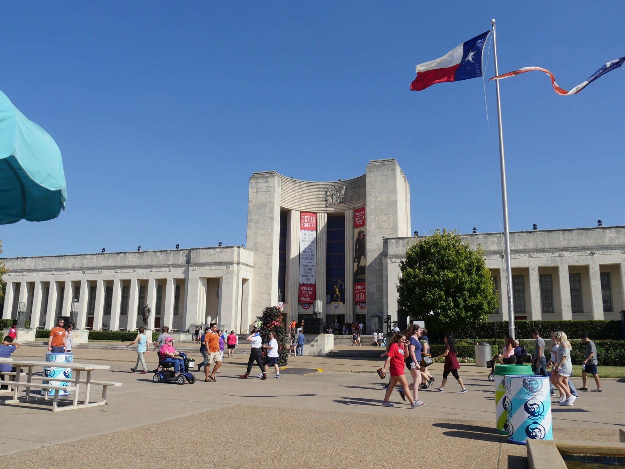 DALLAS, TEXAS—OCTOBER 2017:  People walk infront of the Dallas Hall of State which was part of the State Fair of Texas grounds. The Hall of State commemorates the history of Texas state., License Type: media, Download Time: 2025-03-12T19:07:48.000Z, User: fabricencoredesign31, Editorial: true, purchase_order: 56530 - Guidebooks, job: Global Publishing-WIP, client: Texas 7, other: Fabrice Robin