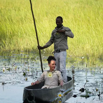 A woman sits in a mokoro in Botswana. 
