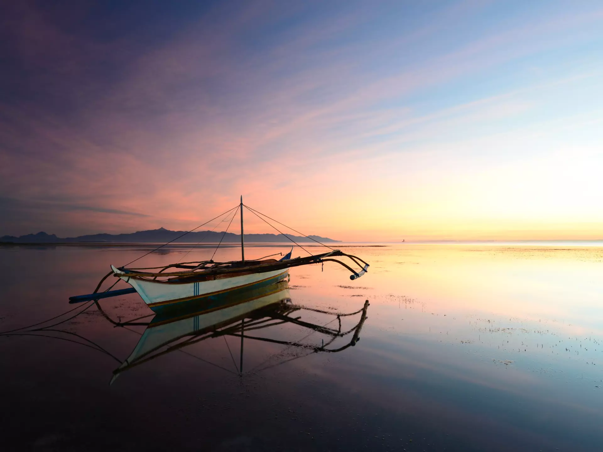 Sunset with moored outrigger.