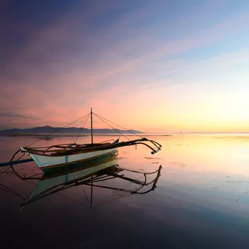 Sunset with moored outrigger.