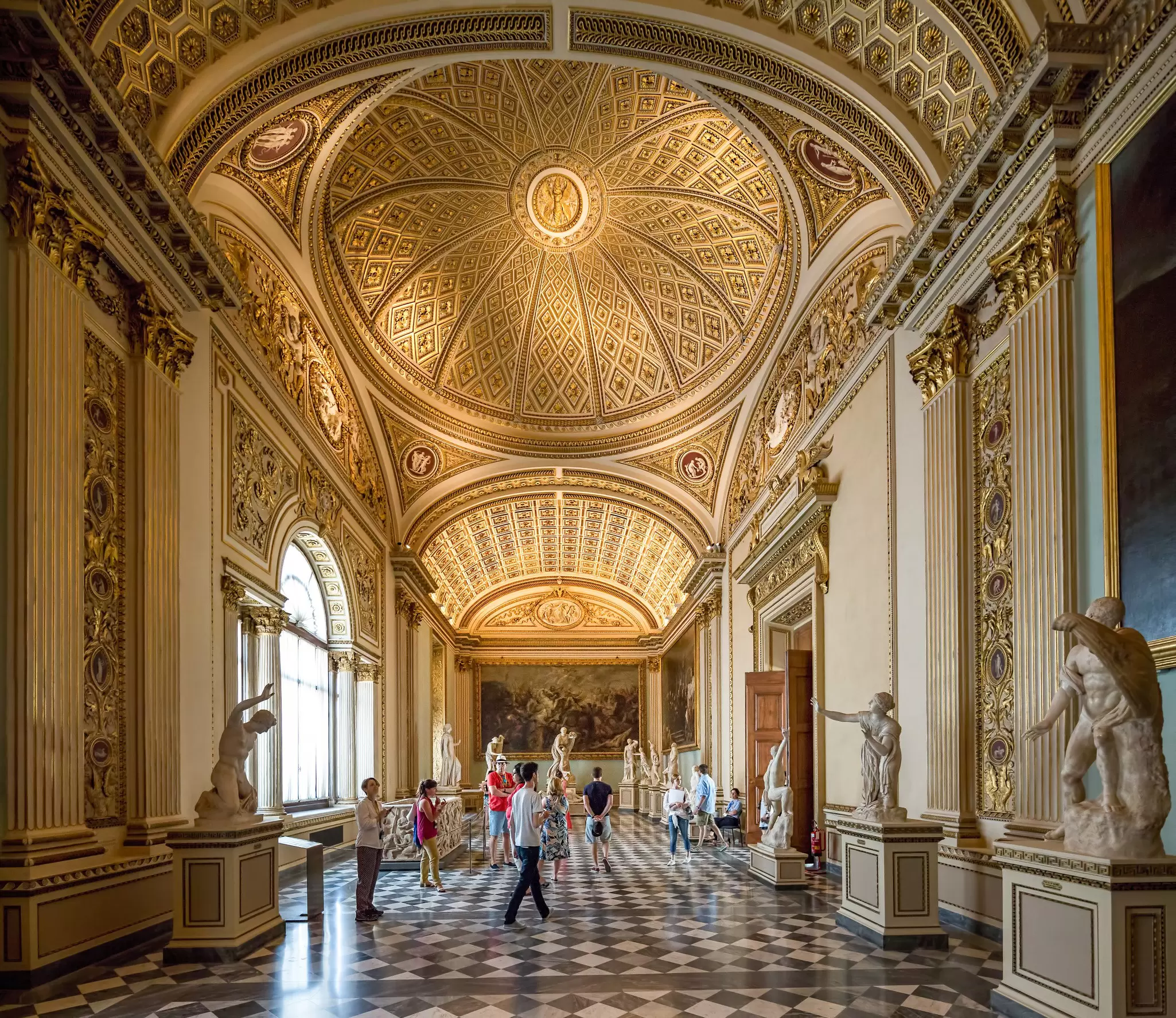 Visitors inside the Sala della Niobe in the Galleria degli Uffizi in Florence, Italy.