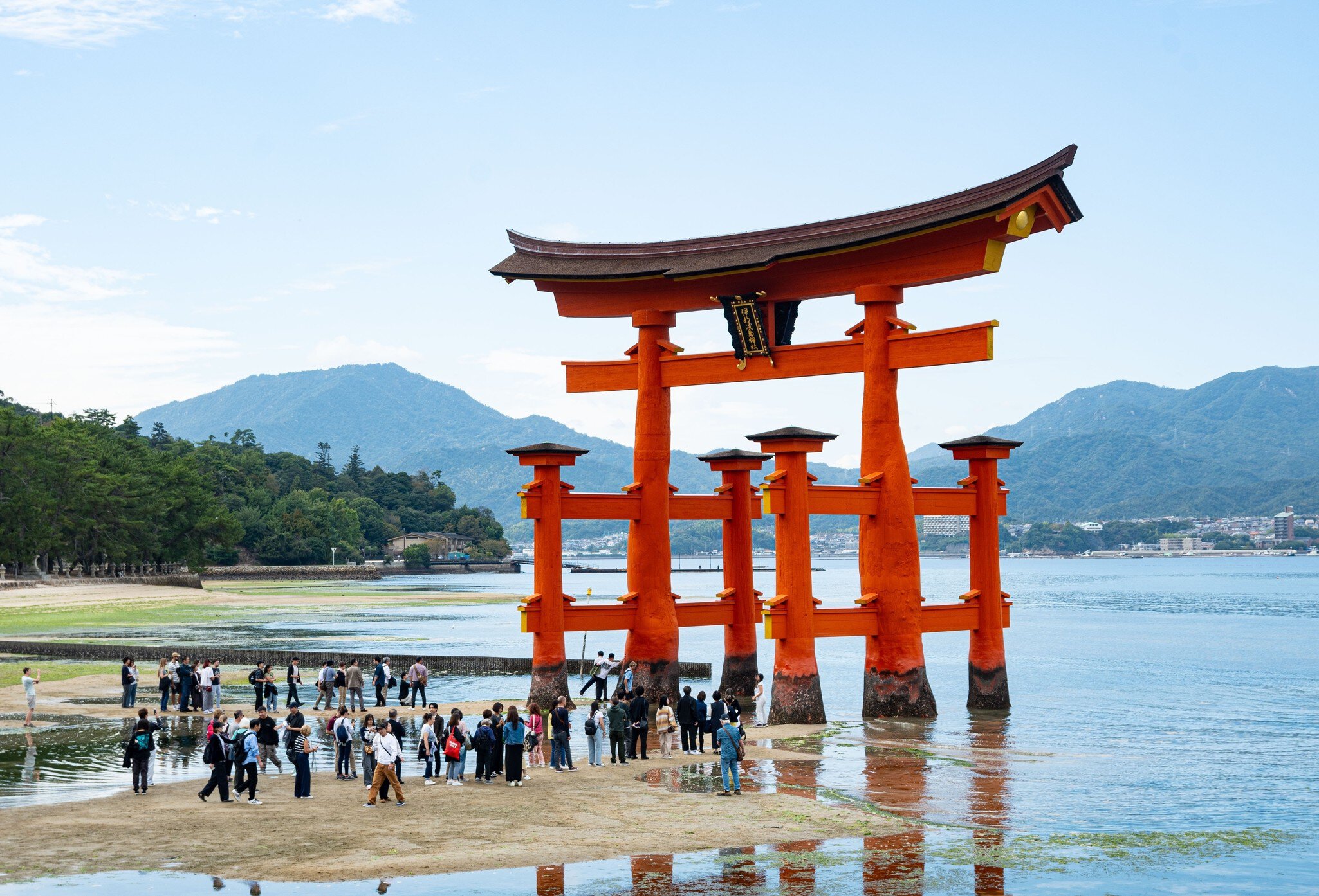 Hiroshima Japan - October 26 2024: tourist at the red Torii Gate at Itsukushima Jinja shinto shrine at low tide outdoor at a beautiful day on a small island in Hiroshima Bay in western of Japan., License Type: media, Download Time: 2025-02-27T18:17:02.000Z, User: rhylton_redventures, Editorial: true, purchase_order: 56530 - Guidebooks, job: Lonely Planet WIP, client: Lonely Planet WIP, other: Rhianydd Hylton