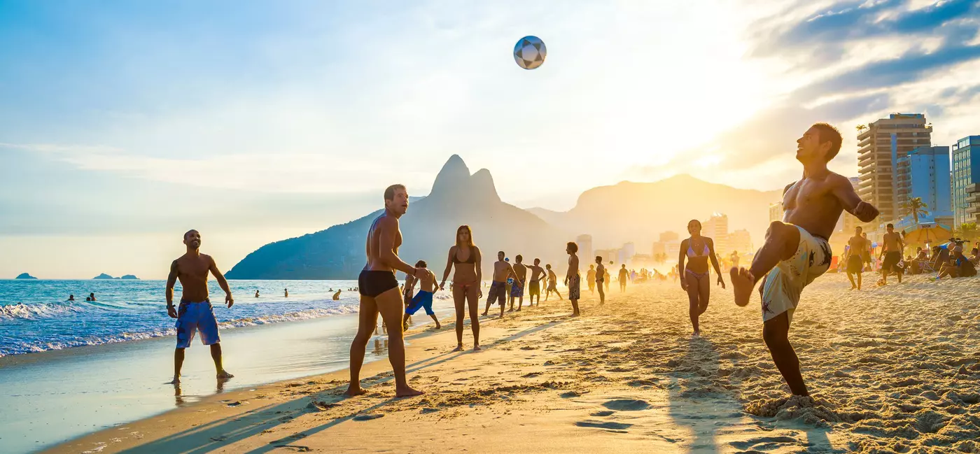 RIO DE JANEIRO - APRIL 01, 2014: Groups of young Brazilians play keepy uppy beach football, or altinho, at sunset on the shore of Ipanema Beach at Posto 9., License Type: media, Download Time: 2025-05-28T09:45:27.000Z, User: lonelyplanetmedia, Editorial: true, purchase_order: 65050 - Digital Destinations and Articles, job: Global Publishing WIP, client: Global Publishing WIP, other: Peterson Haggarty // SS Comp Ingestion