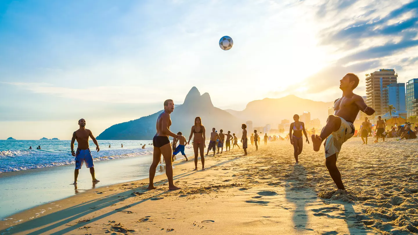 RIO DE JANEIRO - APRIL 01, 2014: Groups of young Brazilians play keepy uppy beach football, or altinho, at sunset on the shore of Ipanema Beach at Posto 9., License Type: media, Download Time: 2025-05-28T09:45:27.000Z, User: lonelyplanetmedia, Editoria...