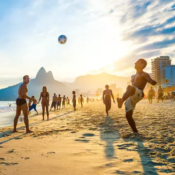 RIO DE JANEIRO - APRIL 01, 2014: Groups of young Brazilians play keepy uppy beach football, or altinho, at sunset on the shore of Ipanema Beach at Posto 9., License Type: media, Download Time: 2025-05-28T09:45:27.000Z, User: lonelyplanetmedia, Editoria...