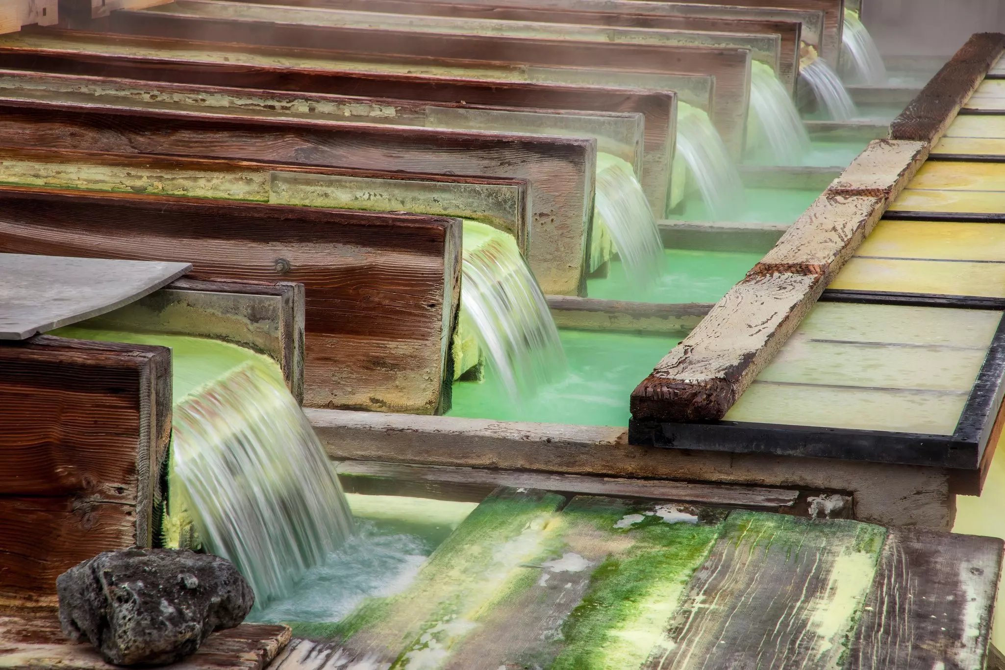 Water pours out of troughs.