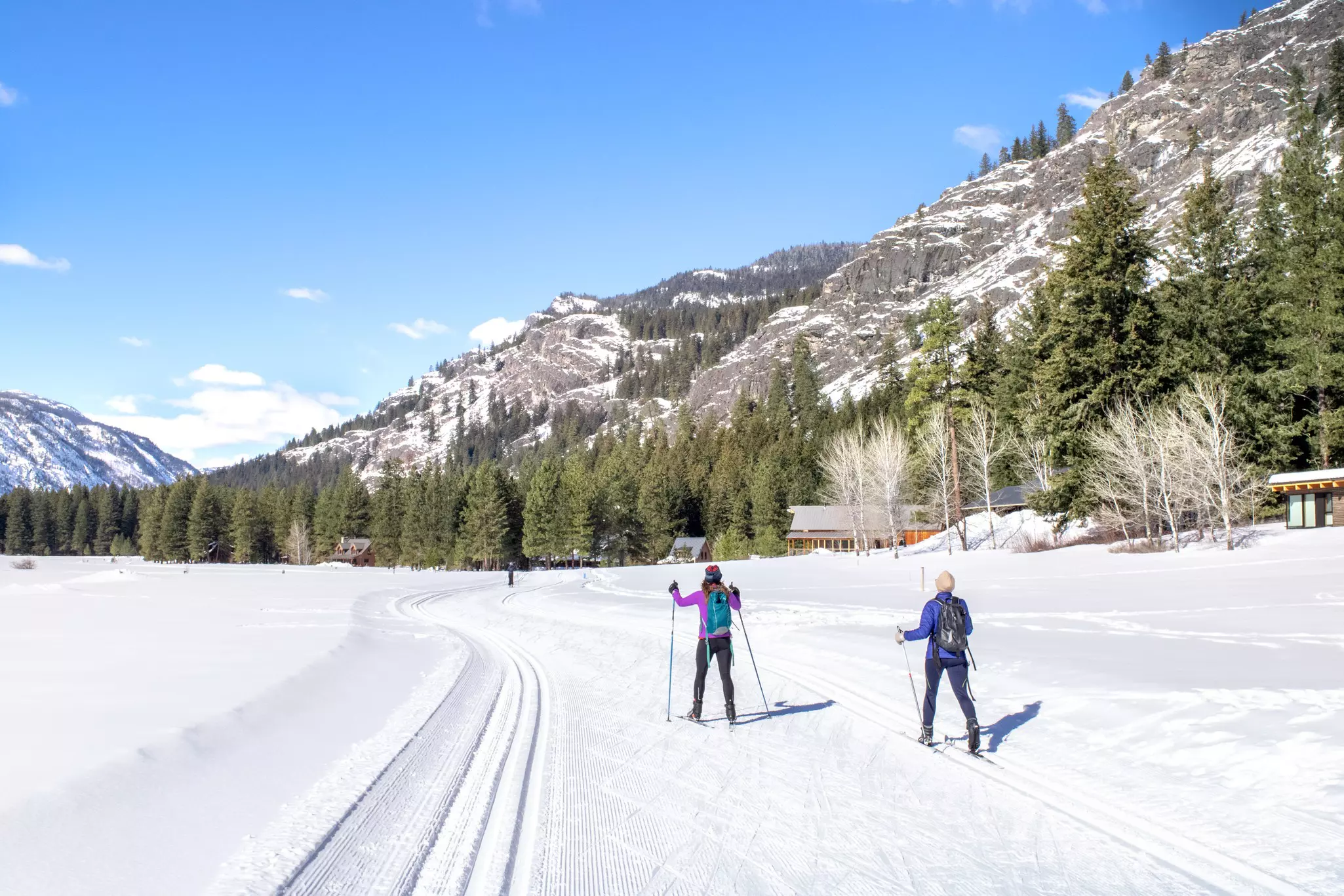 Skiers on trail in the Methow Valley near North Cascades National Park.