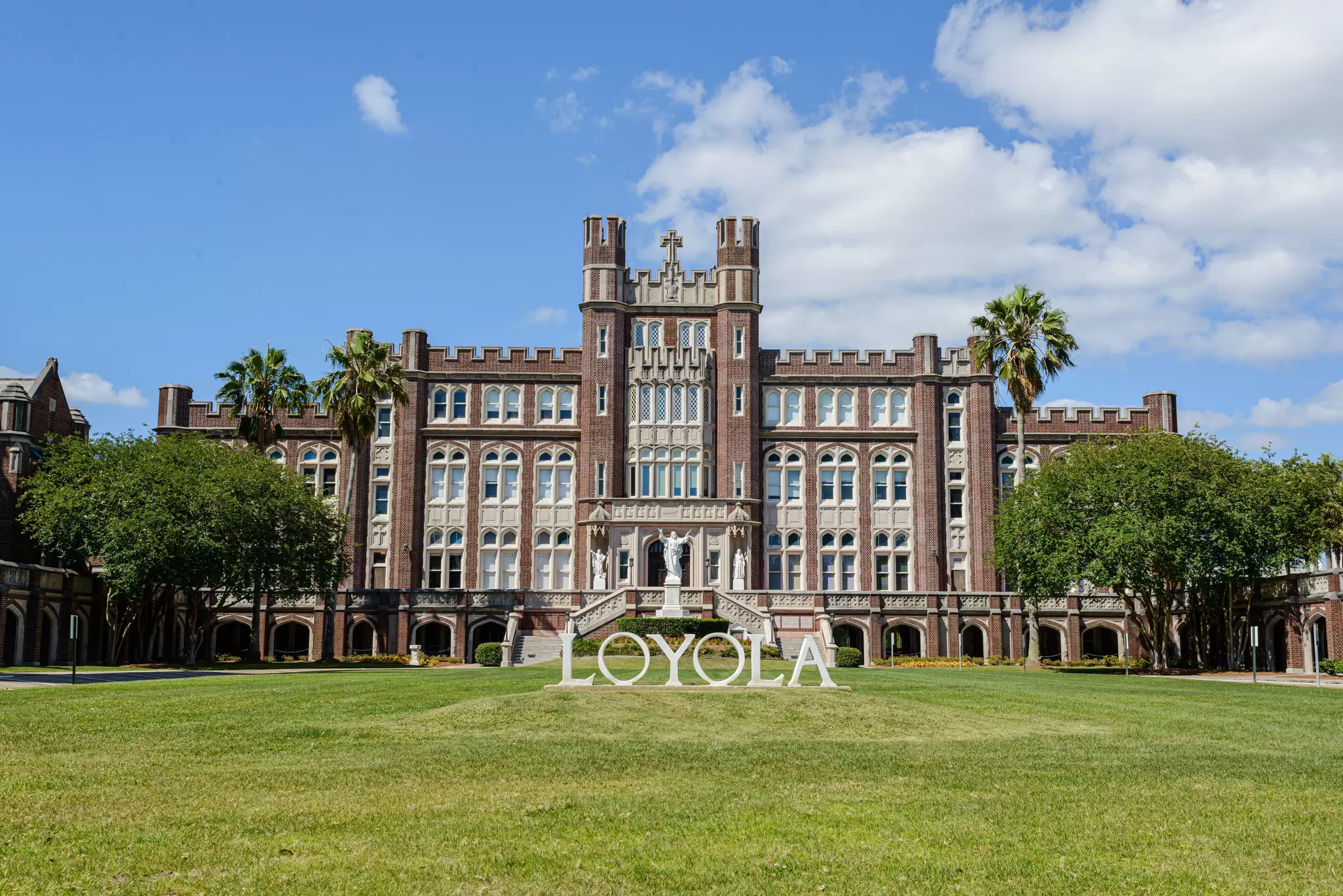View of the Loyola University administration building and sign in New Orleans, Louisiana.