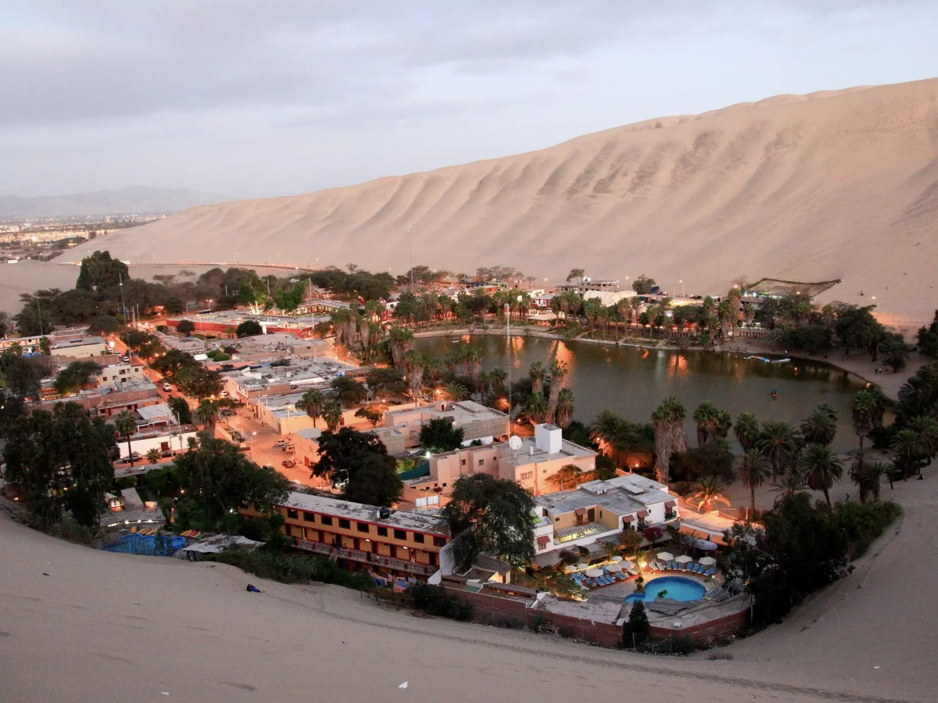 A center for adrenaline-fueled outdoor adventures, the small desert oasis of Huacachina makes a popular day trip from Lima, Peru. Shutterstock