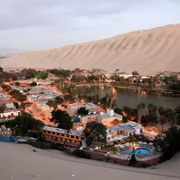 A center for adrenaline-fueled outdoor adventures, the small desert oasis of Huacachina makes a popular day trip from Lima, Peru. Shutterstock