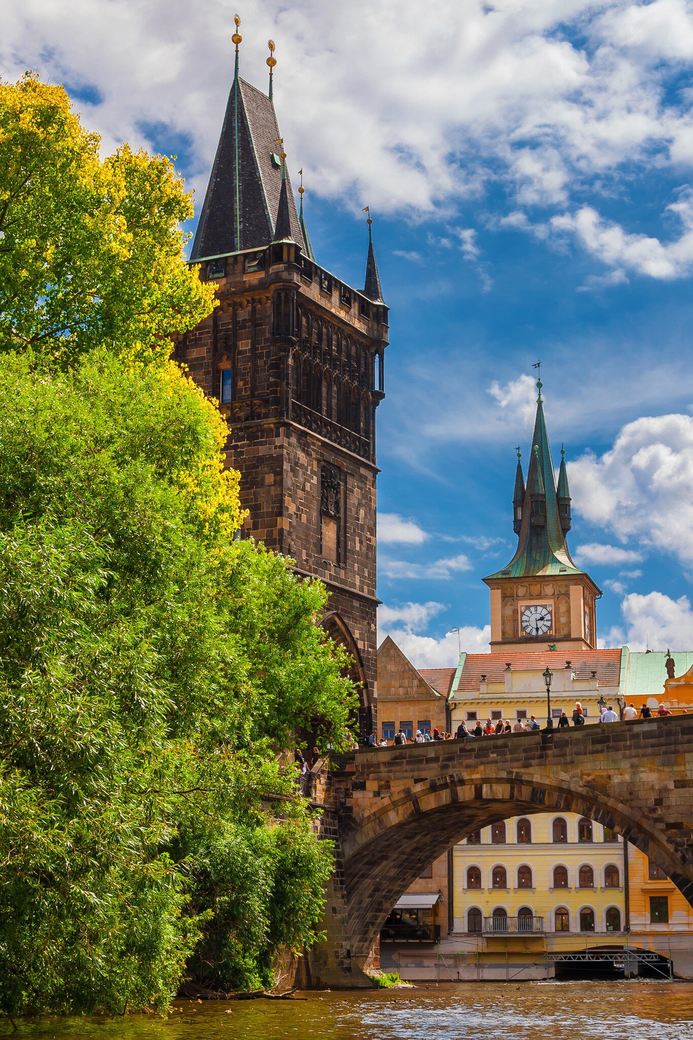 Medieval Charles Bridge on River Vltava with Old Town Bridge Tower and Water Tower in Prague, Czech Republic.