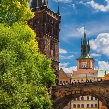 Medieval Charles Bridge on River Vltava with Old Town Bridge Tower and Water Tower in Prague, Czech Republic.