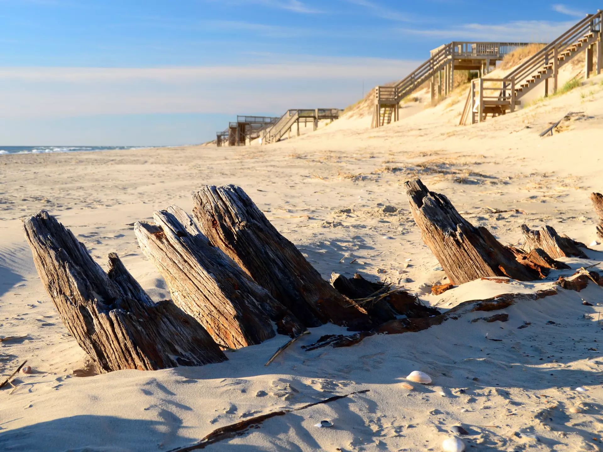 The remains of a historic shipwreck poke through the sands along the Outer Banks of North Carolina