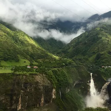 A waterfall amongst mountains in Banos de Agua Santa, Ecuador.