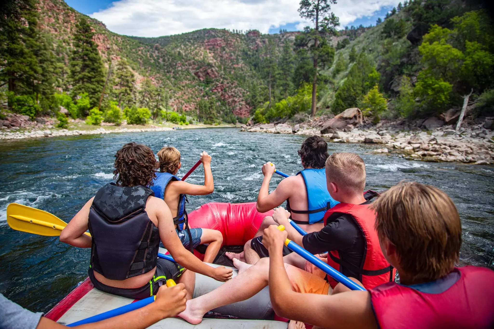 A group of boys with an adult on a rafting trip down the Colorado River
