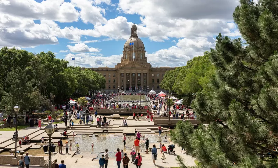 People gathering in front of the Alberta Legislature Building on Canada Day in Edmonton