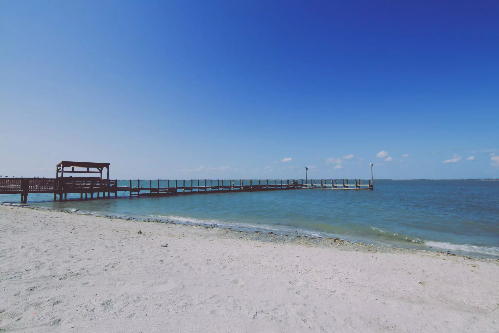 Horace Caldwell Pier on Mustang Island in Corpus Christi, Texas on a sunny day