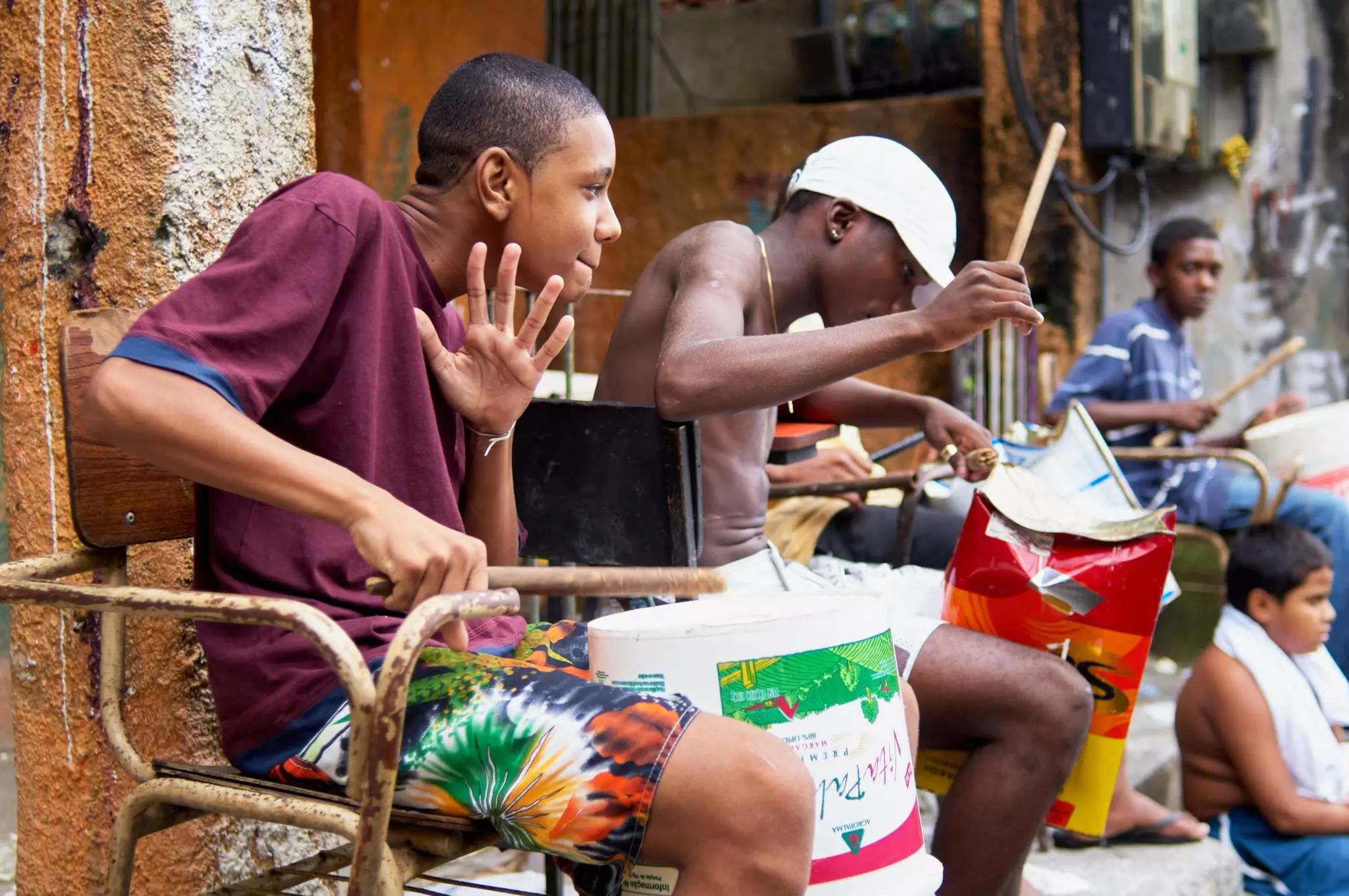 Rocinha Rio De Janeiro Brazil - Group of boys playing drums at alley way at Rocinha.