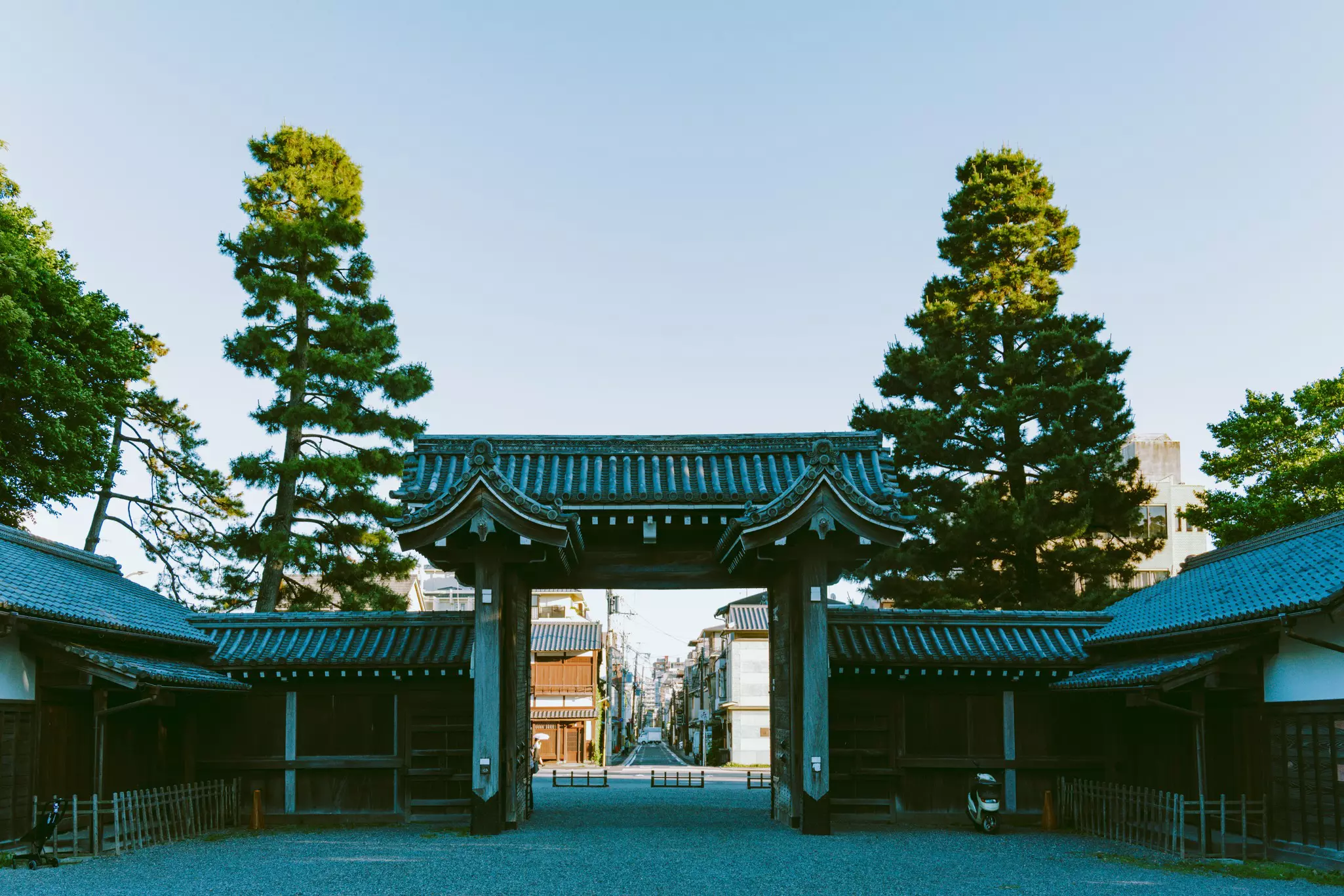 City streets through an imperial gate at a historic structure in Japan.