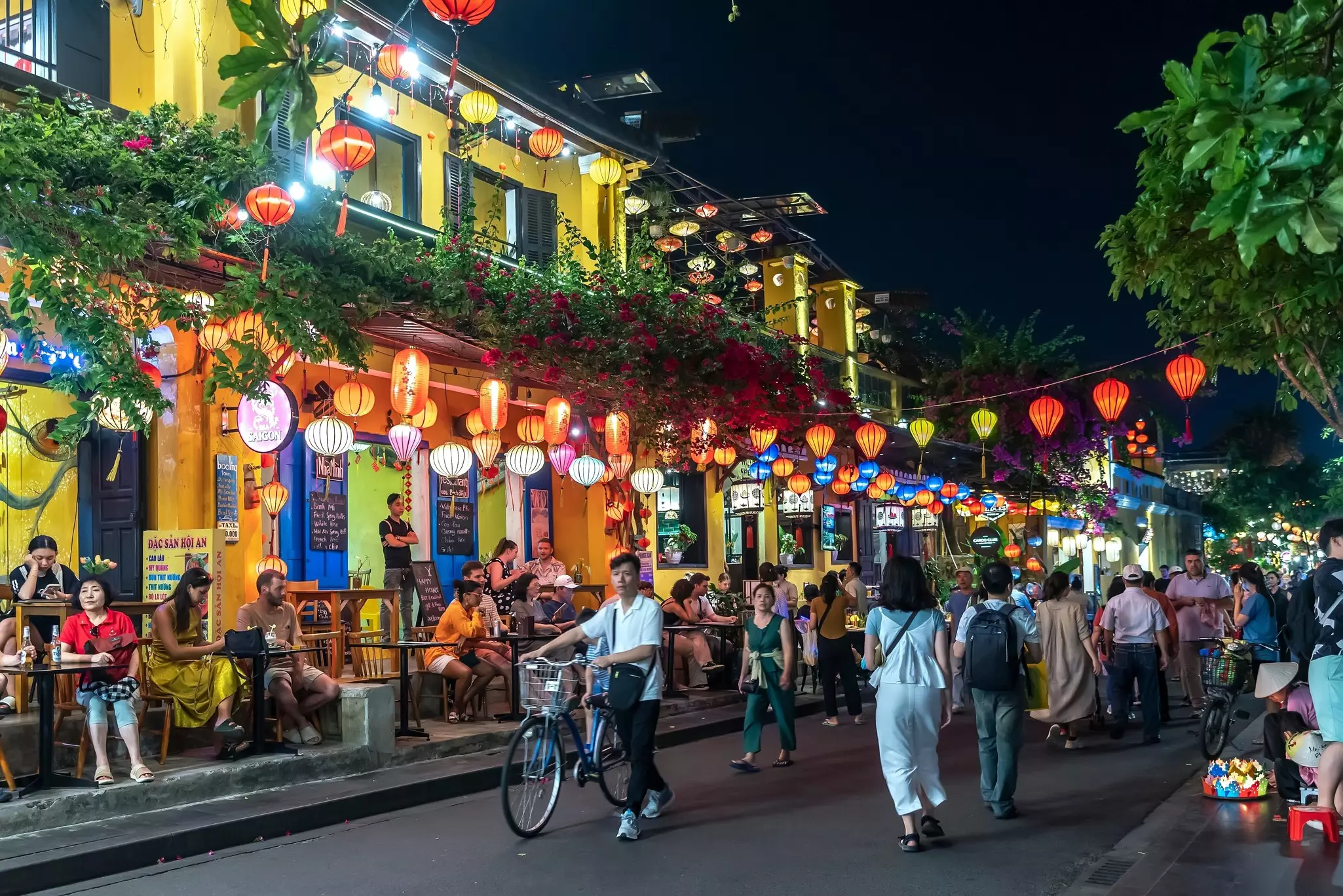 A busy street at night in Old Town, Hoi An, with colorful lanterns all around