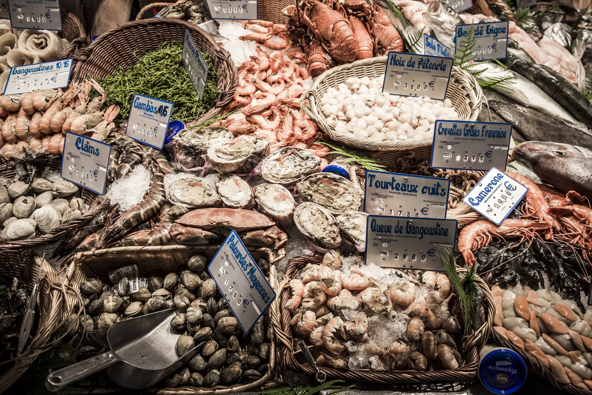 A profusion of shellfish and seafood on sale at the Marché Victor Hugo in Toulouse, France