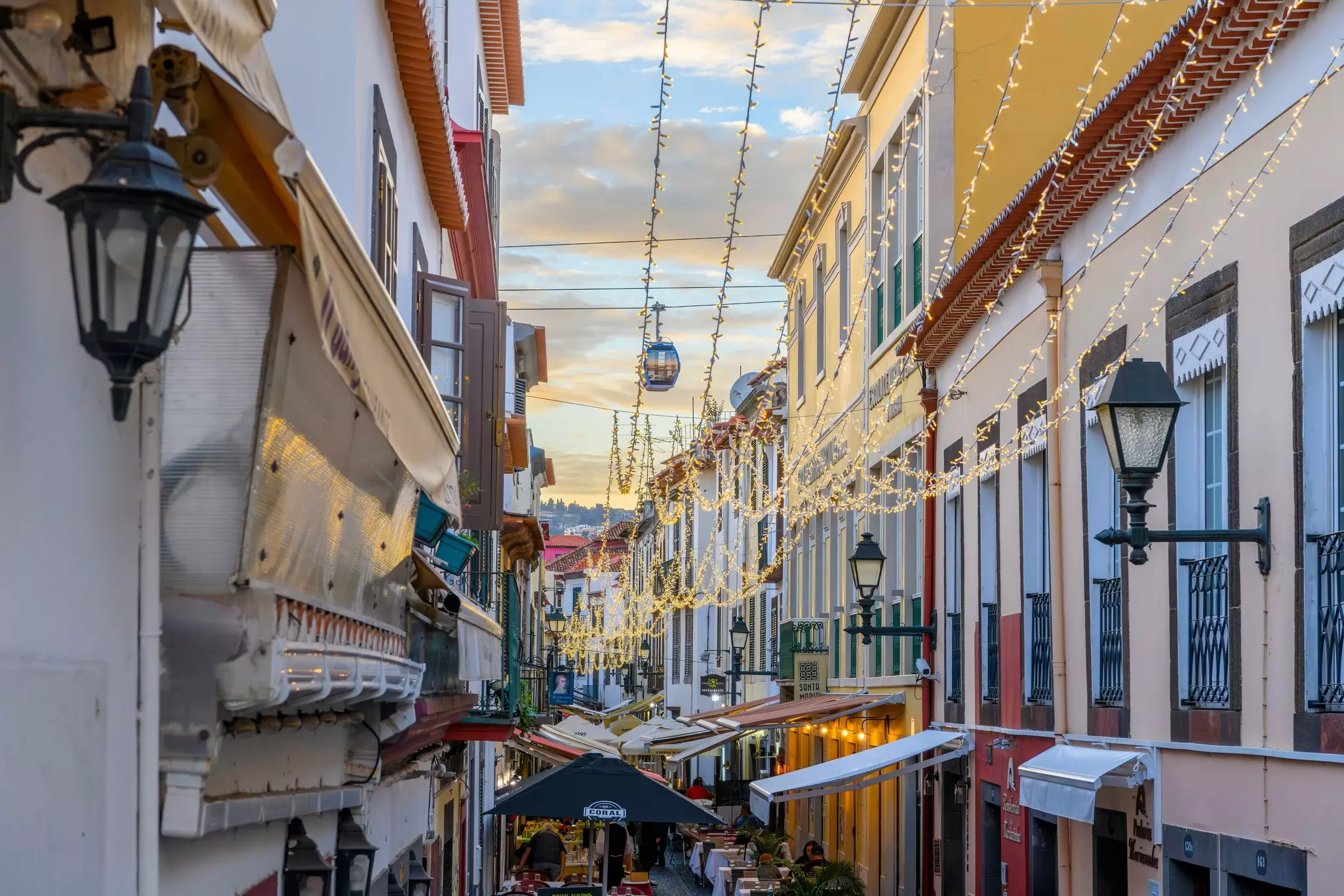 Shops and cafes along Rua de Santa Maria in Funchal.