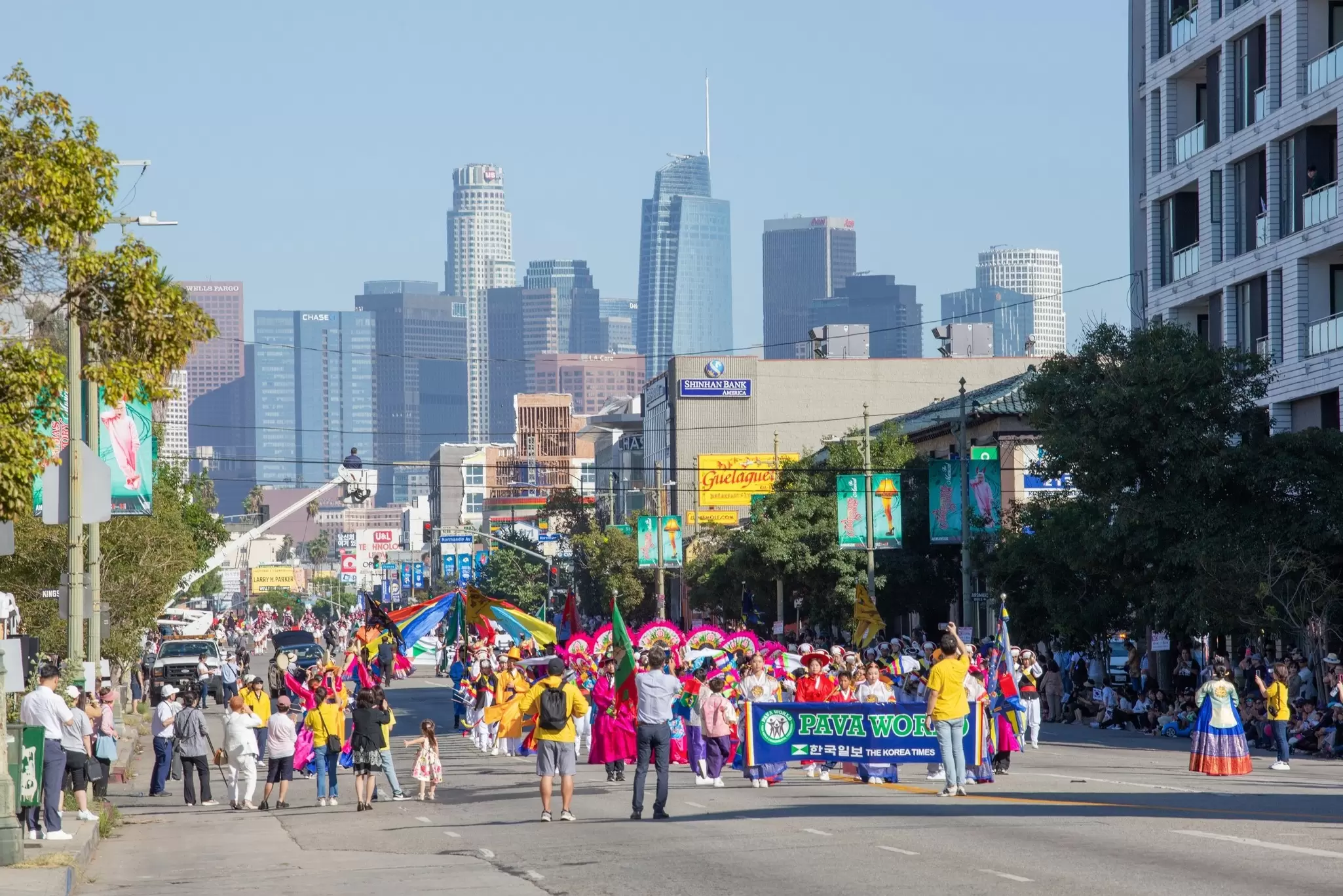 A parade of Korean shop owners walking down Olympic Boulevard in Los Angeles. 
