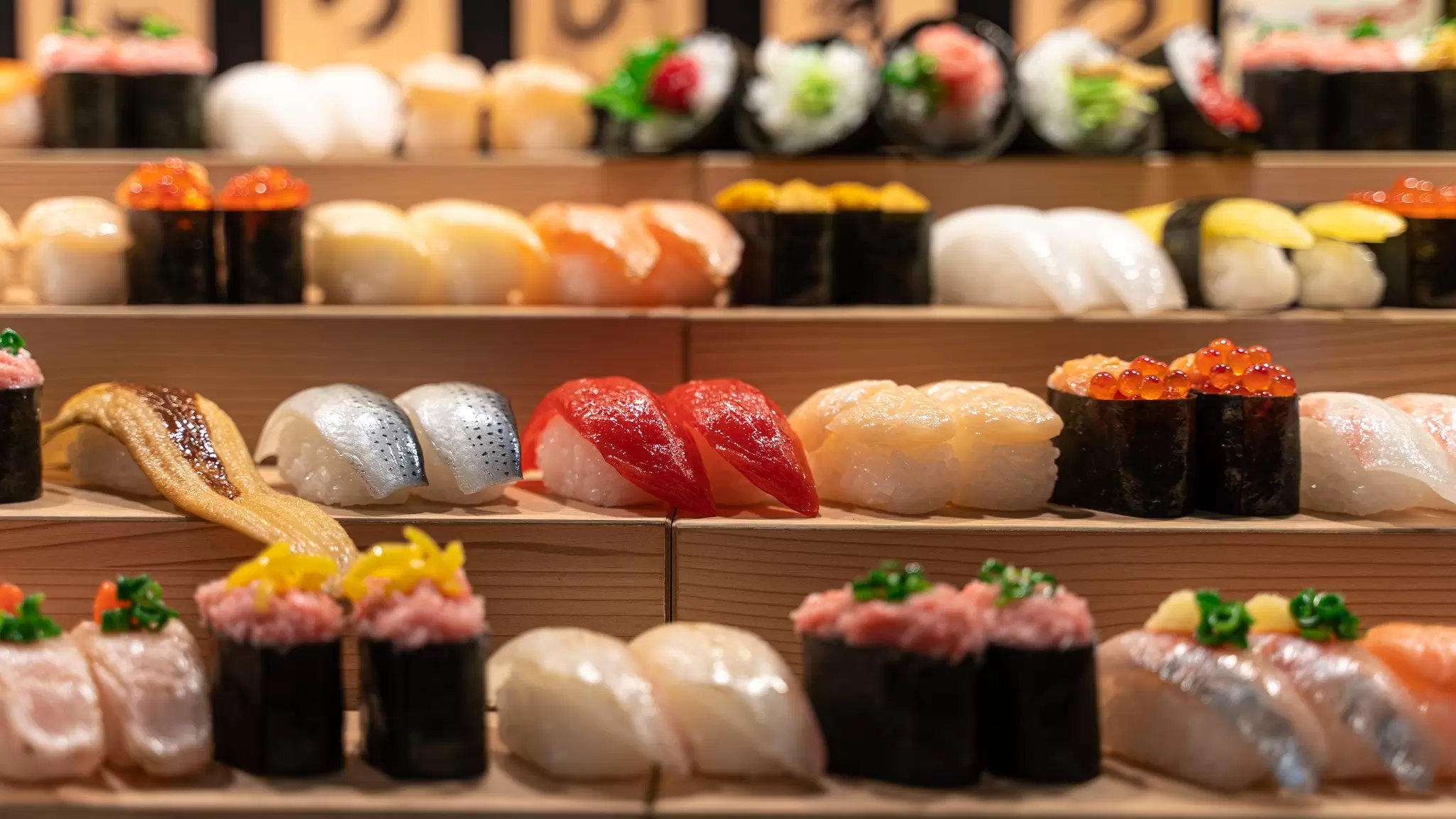 Nigiri-zushi and maki-zushi on a stand in Tokyo. Ruben Earth/Getty Images