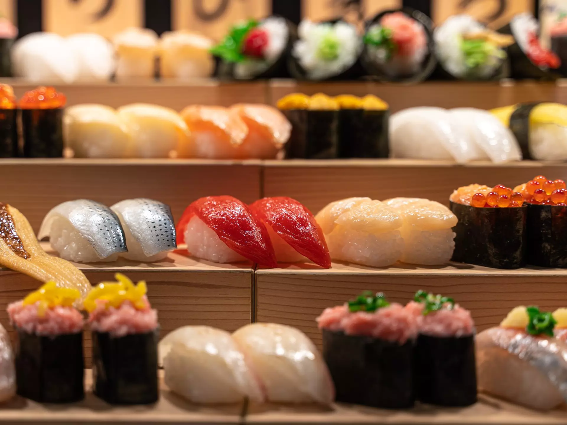Nigiri-zushi and maki-zushi on a stand in Tokyo. Ruben Earth/Getty Images