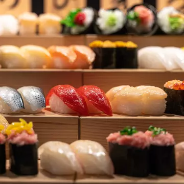 Nigiri-zushi and maki-zushi on a stand in Tokyo. Ruben Earth/Getty Images