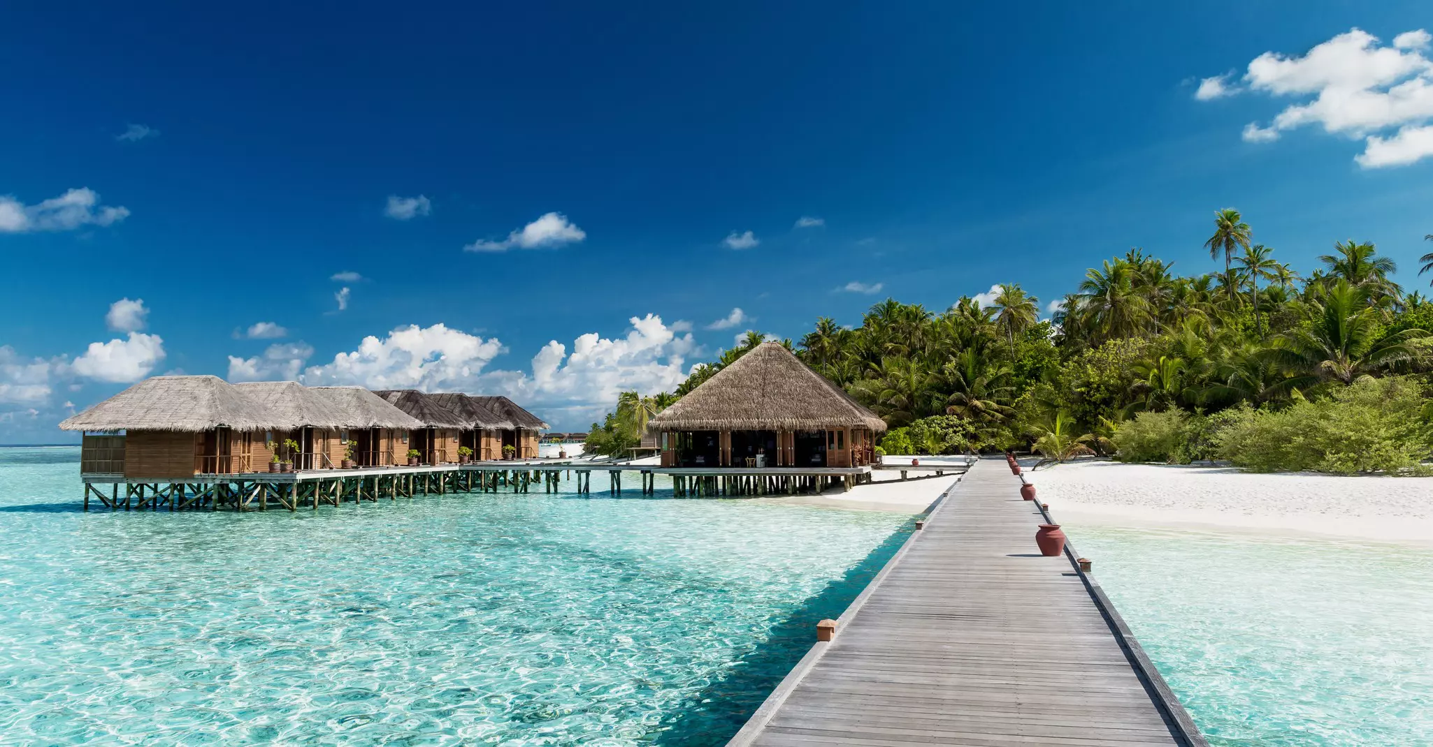 Tropical beach with water-bungalows on the Maldives