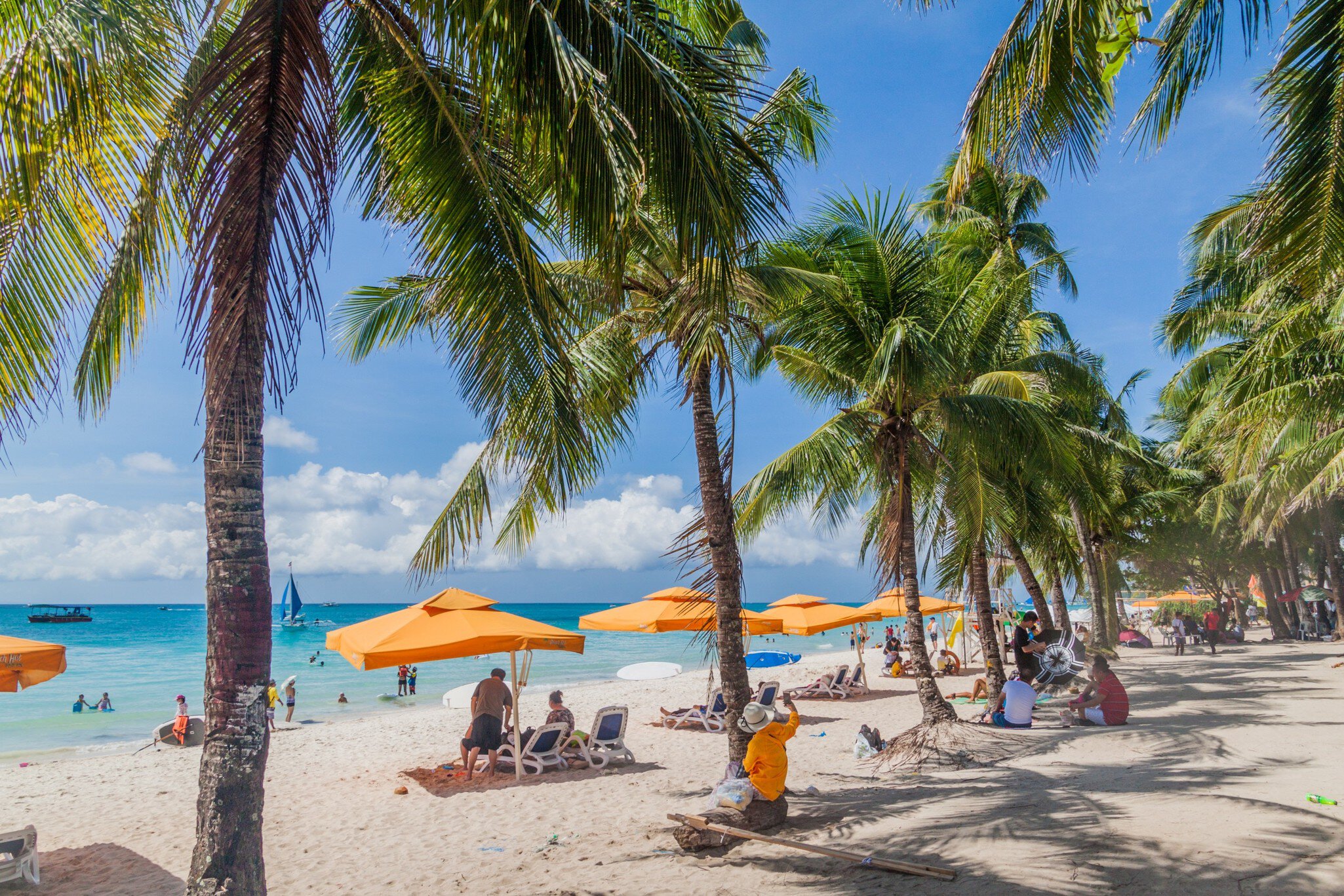 BORACAY, PHILIPPINES - FEBRUARY 1, 2018: Tourists enjoy the White Beach at Boracay island, Philippines; Shutterstock ID 1741828760;