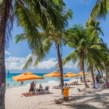 BORACAY, PHILIPPINES - FEBRUARY 1, 2018: Tourists enjoy the White Beach at Boracay island, Philippines; Shutterstock ID 1741828760;