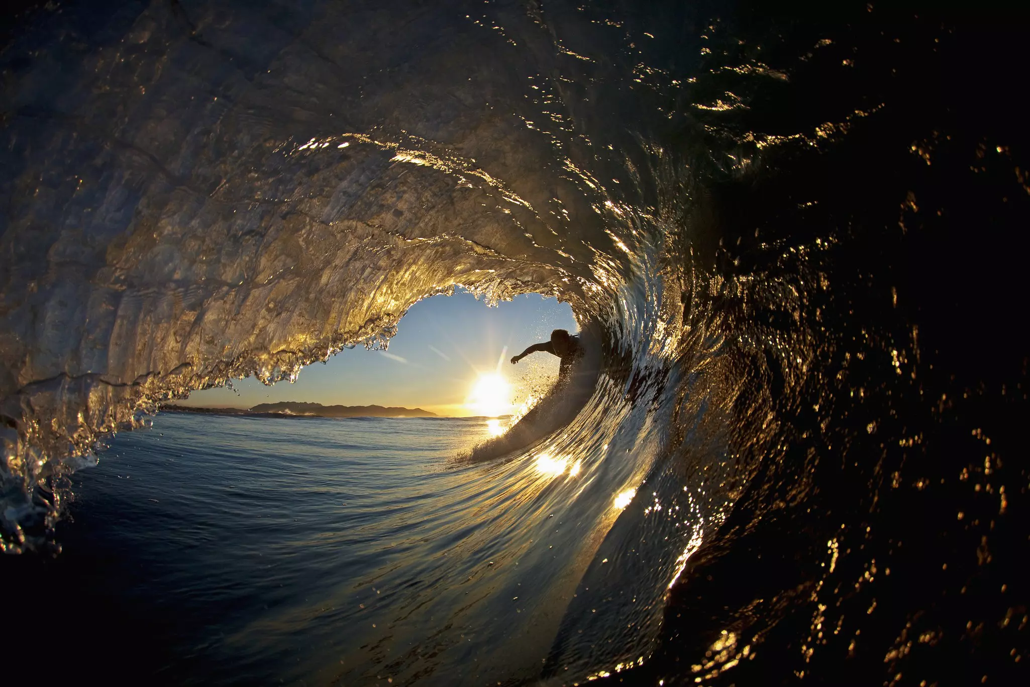 A surfer in the eye of a wave off the coast of Santa Barbara