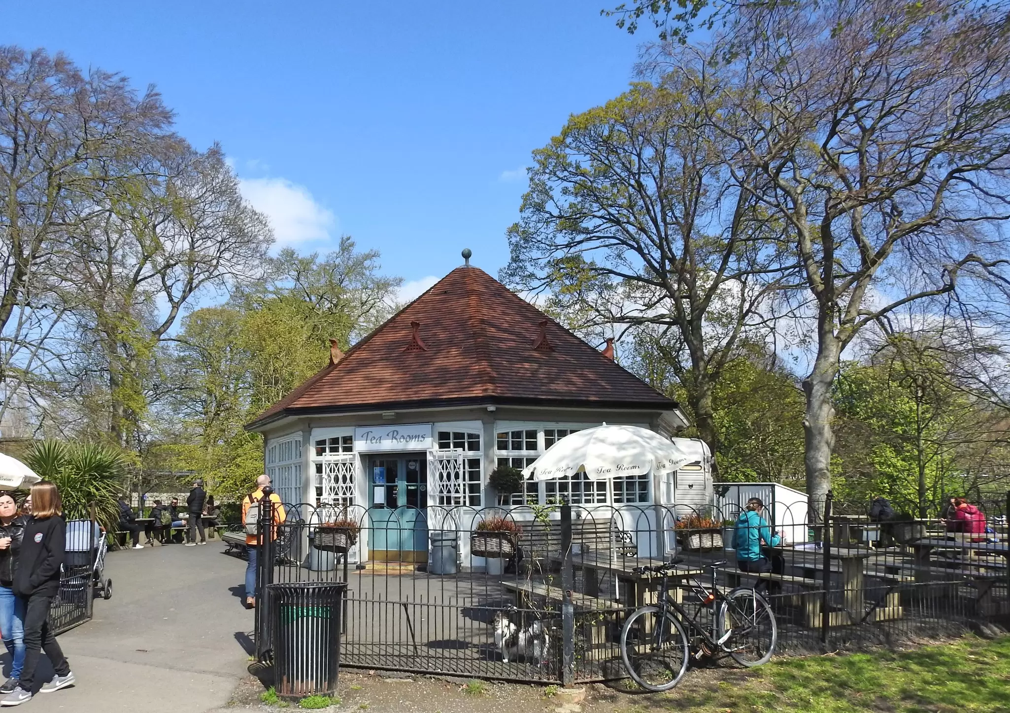 Picnic benches outside the Phoenix Park Tea Rooms on a sunny day in Dublin. 