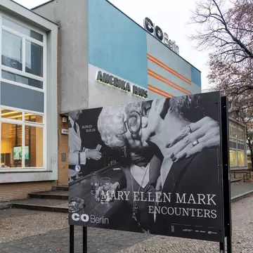 C O Berlin photography gallery at Amerika Haus (America House) with a billboard in front for Mary Ellen Mark Encounters exhibition in Berlin, Germany.