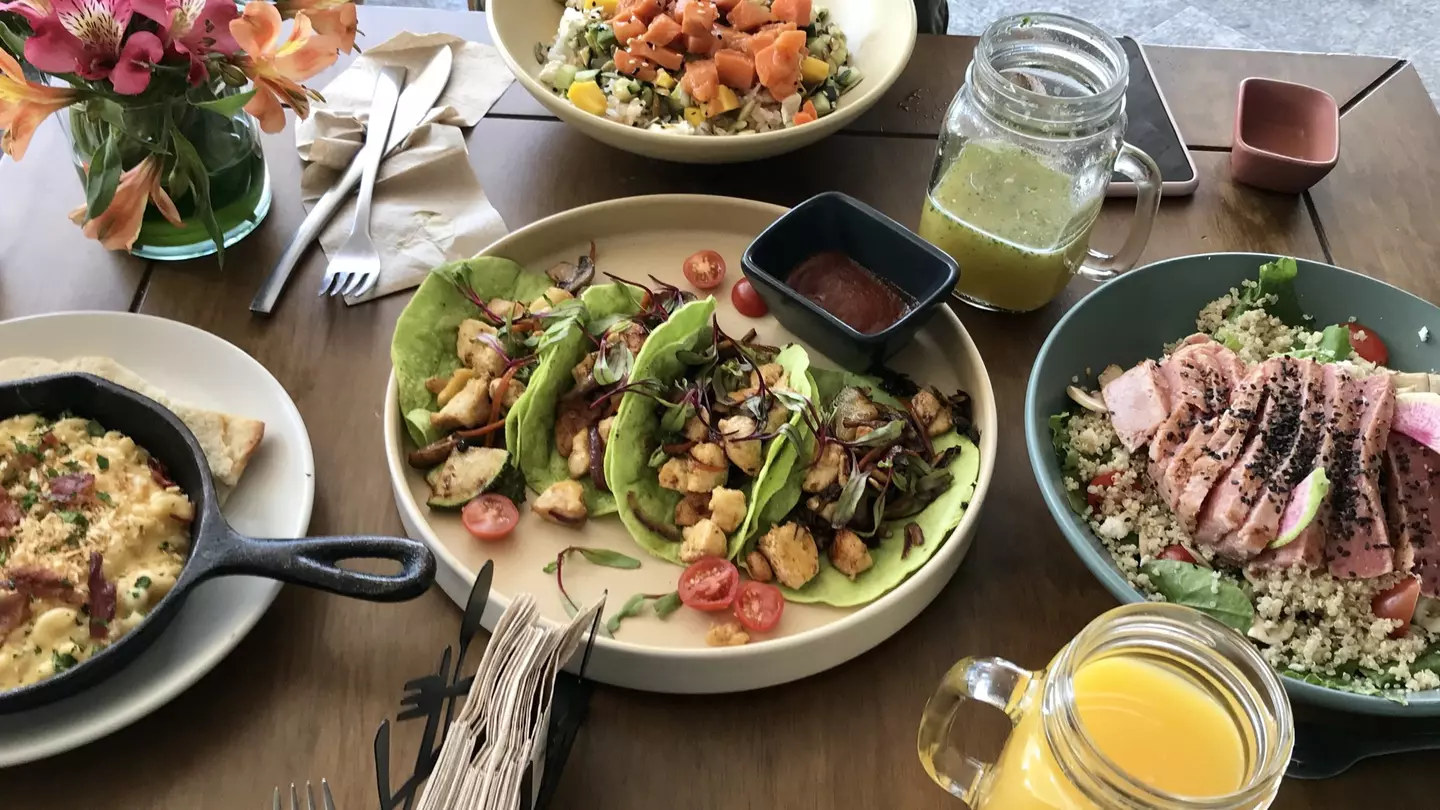Restaurant table full of Mexican dishes