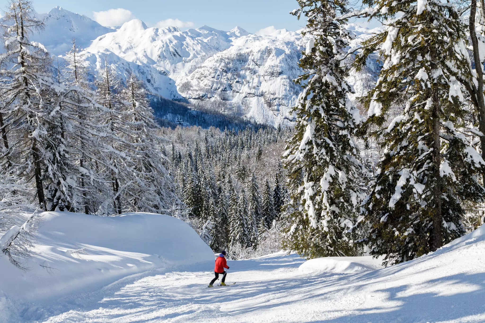 A skier descends a mountain in the Julian Alps, Slovenia