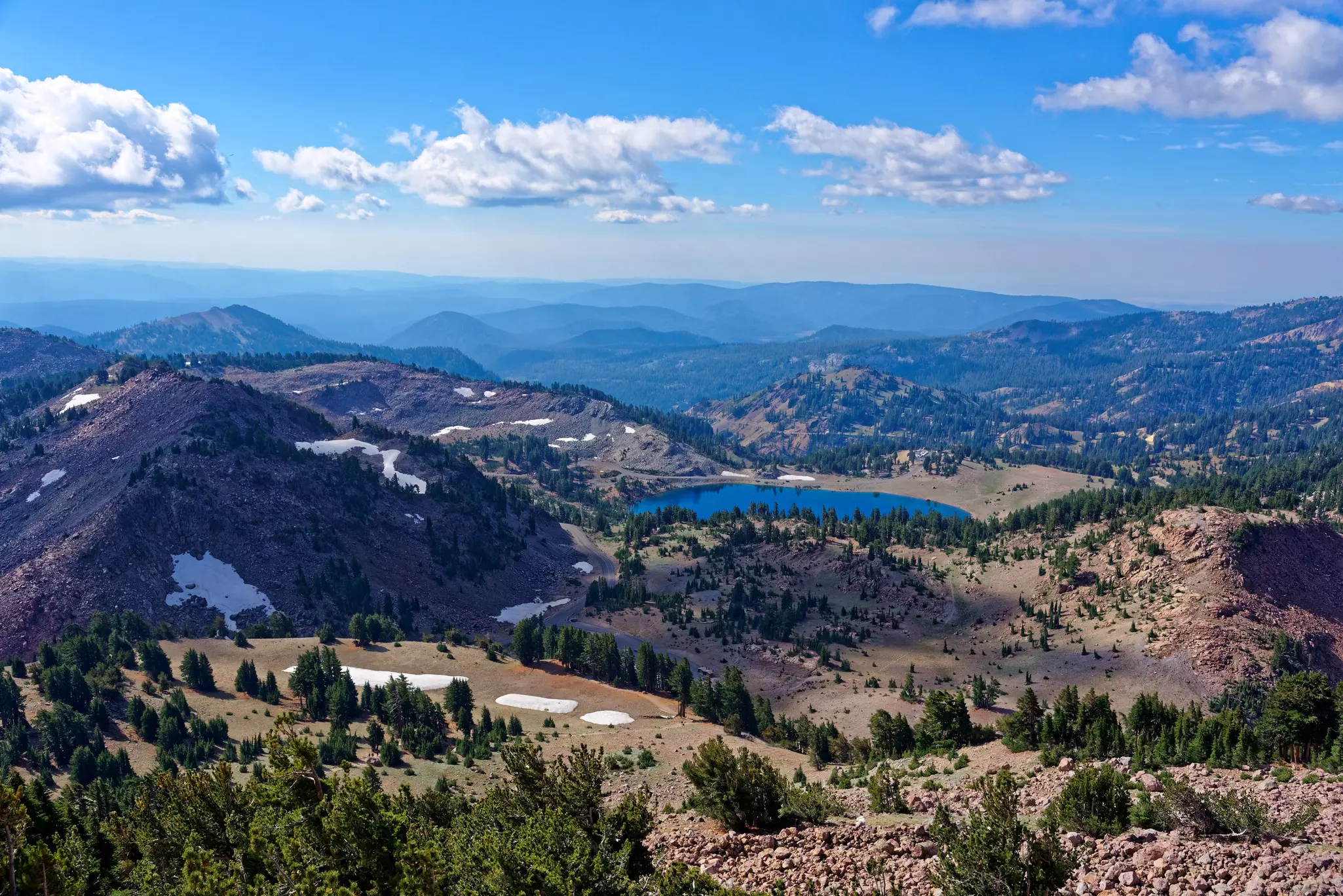 Vista from Lassen Peak in Lassen Volcanic National Park featuring Lake Helen in the foreground
