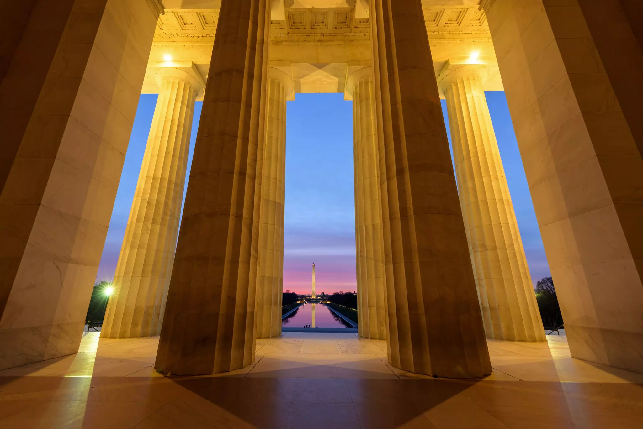 Wide angle view of Washington Monument with its reflection  from Lincoln Memorial at Sunrise, Washington DC
