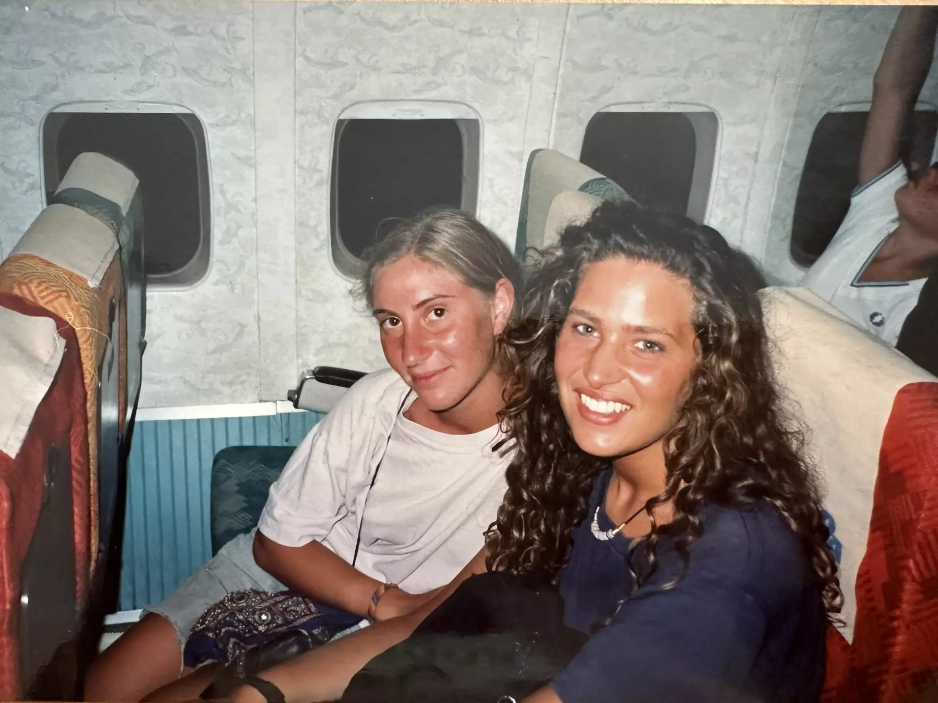 Caroline and a friend on a train in Greece.