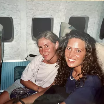 Caroline and a friend on a train in Greece.