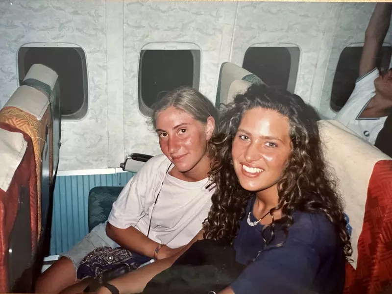 Caroline and a friend on a train in Greece.