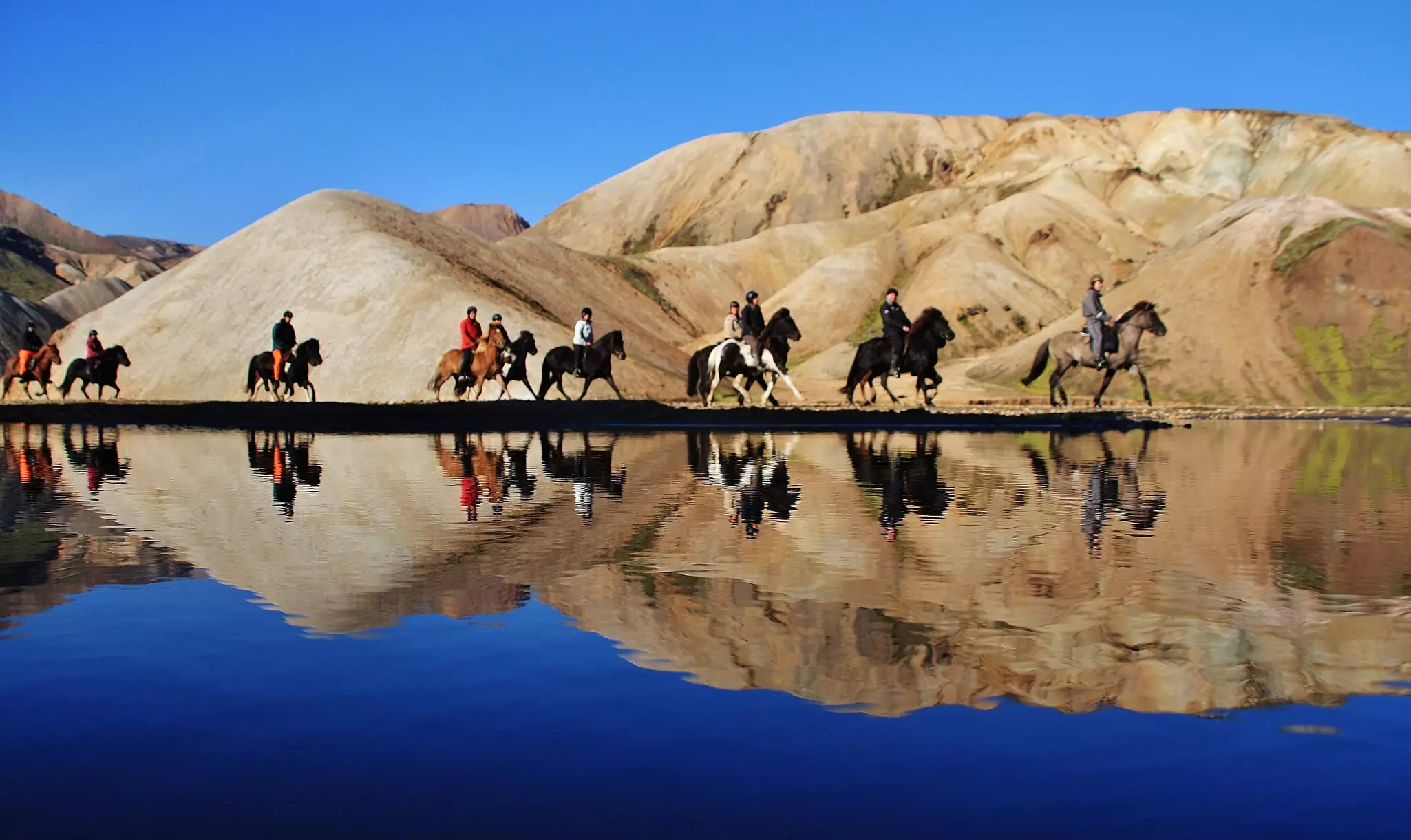 A group of riders working their way down from the mountains in Jökulgíl. Jaana-Marja Rotinen / Getty Images
