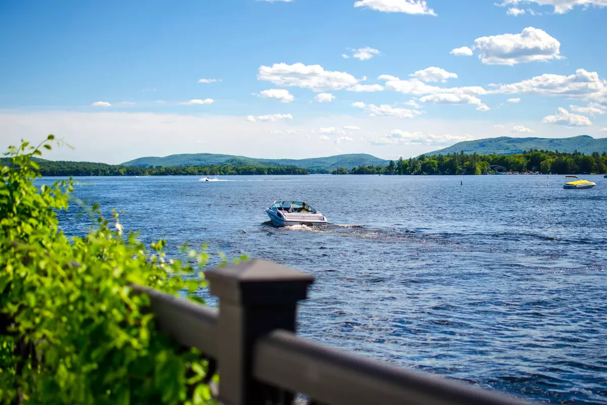 Boat docks on a lake with mountain background. Wolfeboro New Hampshire